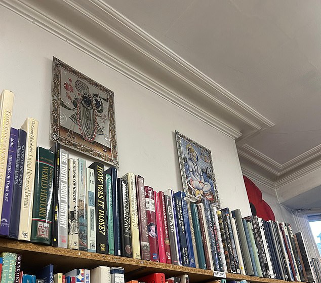 Hindu pictures hang from the walls of the bookshop, which owner Mr Smalley says is a 'hangover' from the earlier years