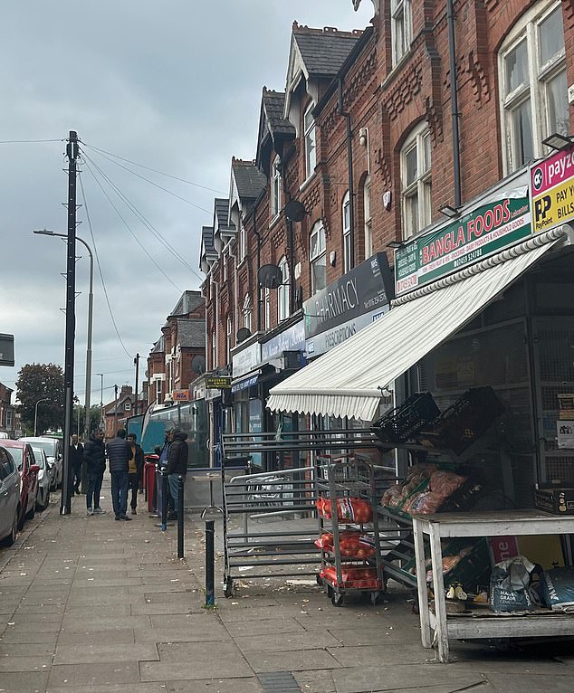 A high street in Highfields, where there are Asian food shops and cafes. Across the road is a primary school, and further down the road sits a mosque