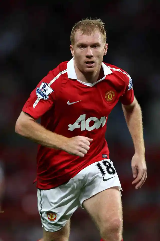 Paul Scholes of Manchester United in his red jersey with number 18 during a football match.