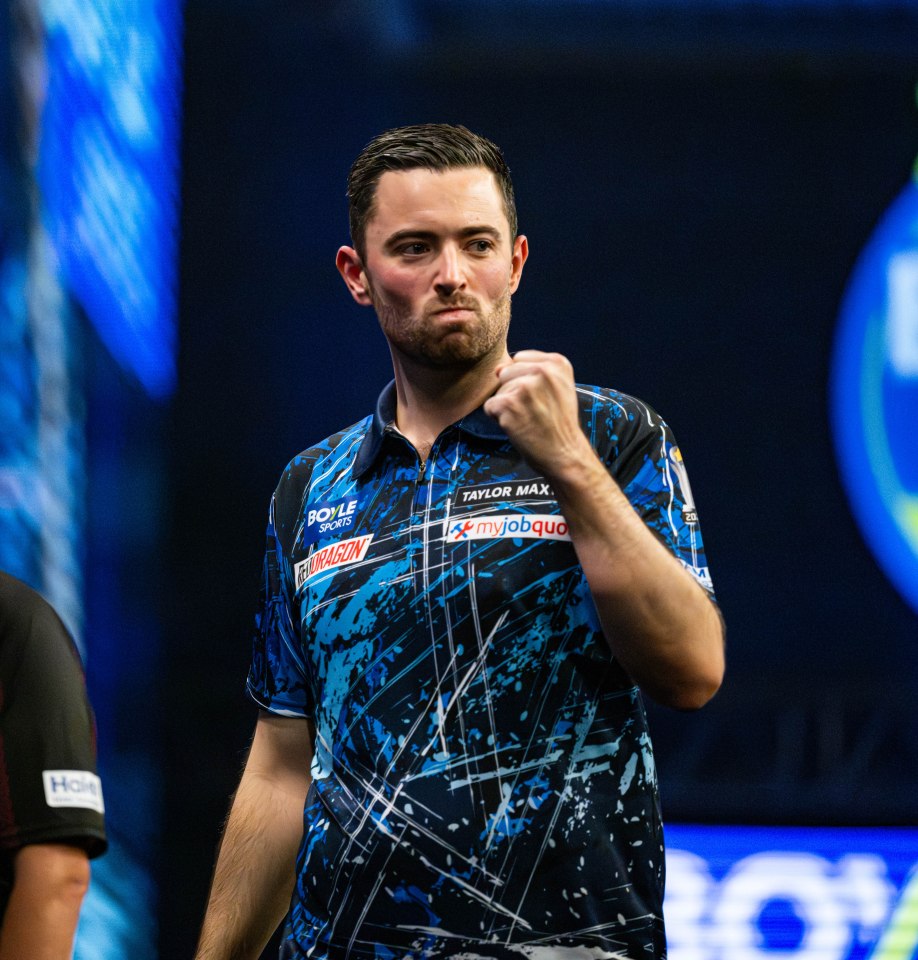 Luke Humphries celebrates his quarter-final victory.