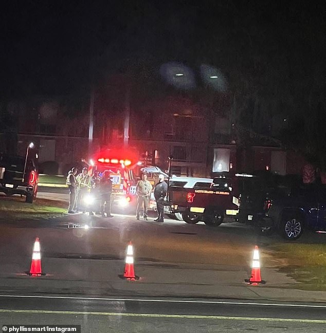 Police are seen outside the restaurant following the fatal shooting Sunday morning