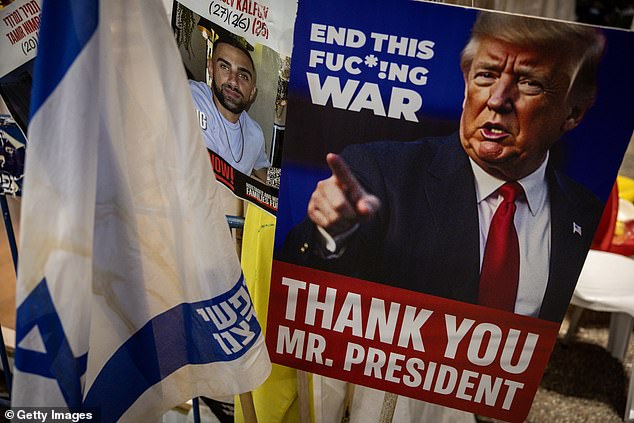 Israelis held pro-Trump posters in Tel Aviv on October 11 after the president brokered the peace deal