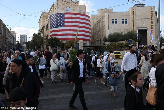 An American Flag covered a historic building in Tel Aviv ahead of Trump's arrival to the city