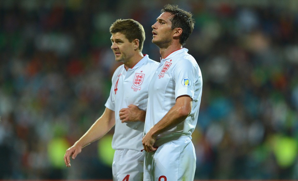 Steven Gerrard and Frank Lampard in England football kits on the field.