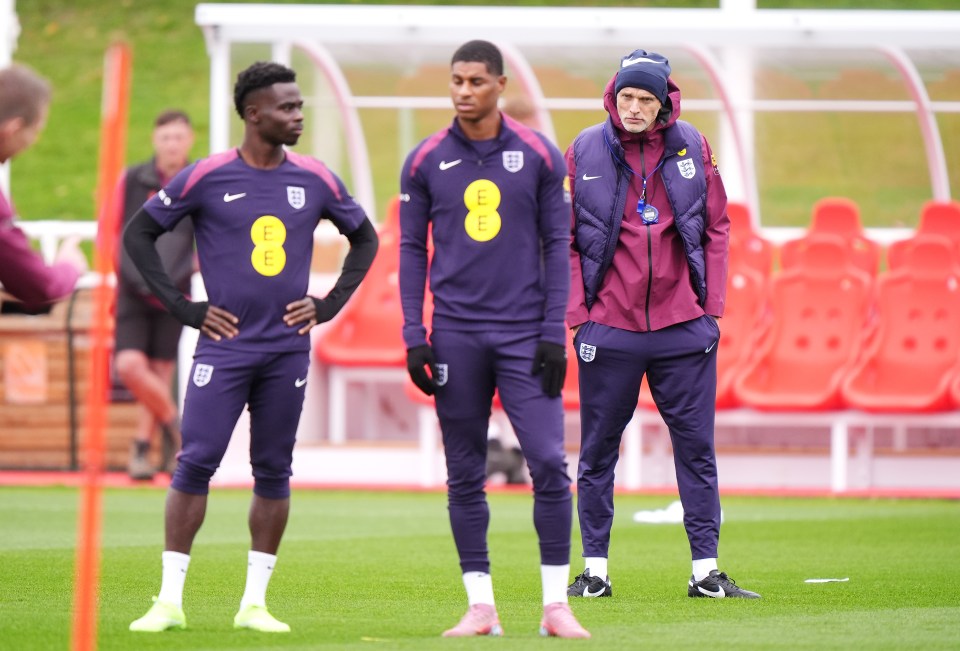 Bukayo Saka, Marcus Rashford, and manager Thomas Tuchel during a training session at St George's Park.