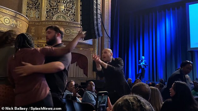 Hecklers have been removed from several of Kamala Harris' book tour venues amid chaos