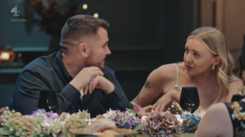 Sarah crying during a tense dinner party.