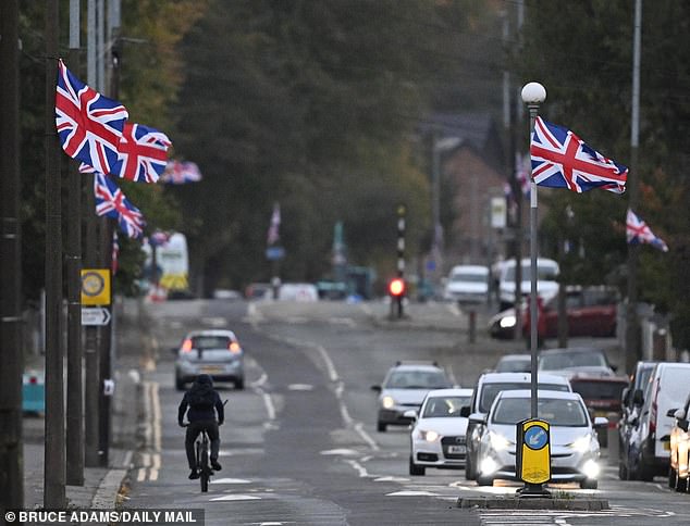 Union and St George's flags have been erected in streets across the country as part of a campaign called 'Operation Raise the Colours' - pictured here are flags in Salford
