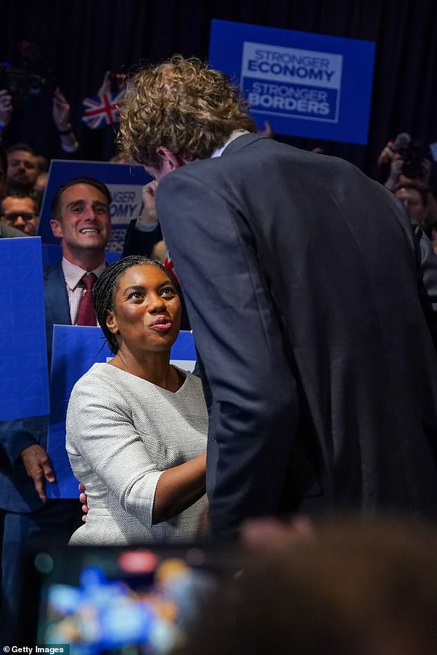 James ¿ all 7'2' of him ¿ was pictured stooping to speak to Badenoch, who stands at 5'4'