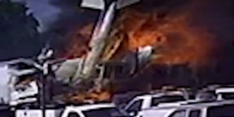 Two dead in horror crash after plane plummets into multiple trucks sparking massive blaze