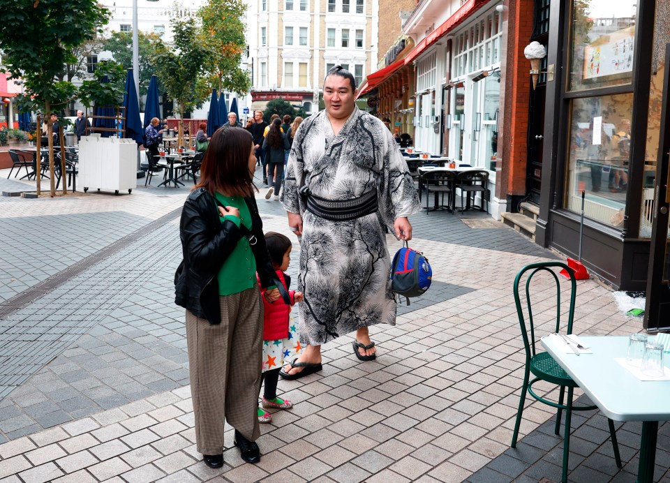 Sumo Wrestling - The Grand Sumo Tournament - Preview - Royal Albert Hall, London, Britain - October 12, 2025 A sumo wrestler known as Rikishi, is seen walking near the Royal Albert Hall. The tournament marks only the second time that Japan's iconic sport has visited the UK, following on from the previous event in 1991. Action Images via Reuters/Peter Cziborra
