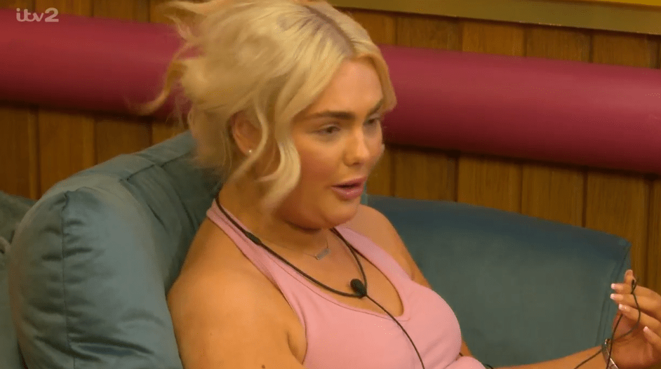 A group of people relaxing in a colorful, modern room with plants and large windows.