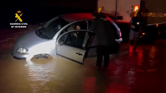 Spain's Guardia Civil rescued people trapped in cars on flooded streets late into the night on Saturday