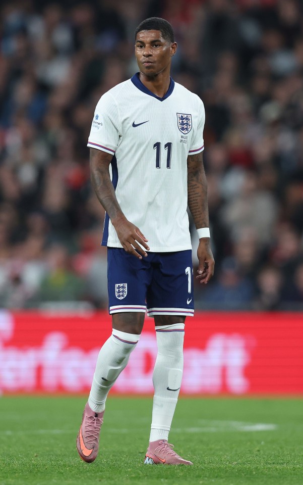 Marcus Rashford of England in a white jersey with the number 11 during an International Friendly match.