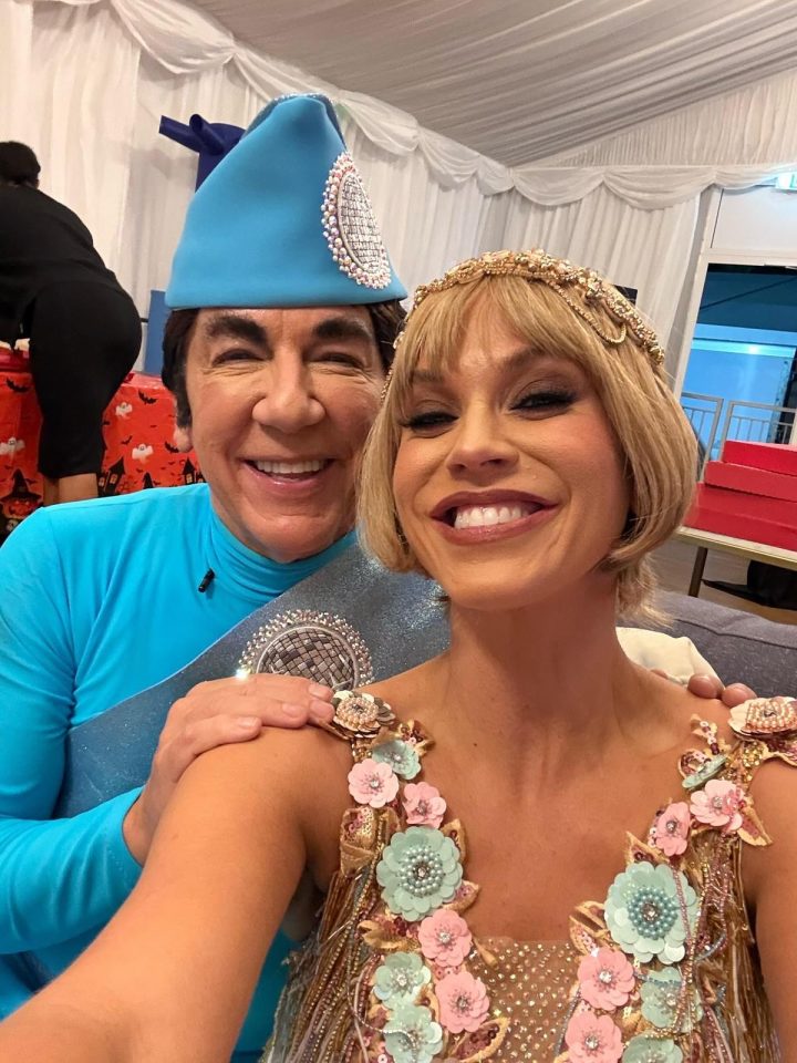 Ross King and a woman smiling while dressed in elaborate costumes.