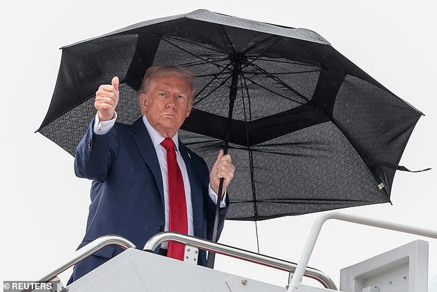 Trump gives a thumbs up while boarding Air Force One, as he departs for Israel, at Joint Base Andrews, Maryland