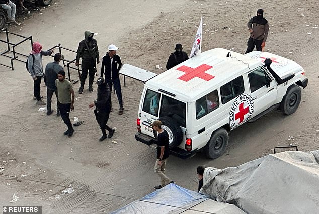 The Red Cross retrieved the hostages from a meeting point in northern Gaza (pictured, a Red Cross vehicle moving in anticipation of the release on Monday)