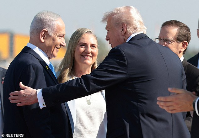 Israeli Prime Minister Benjamin Netanyahu welcomes U.S. President Donald Trump at Ben Gurion International Airport, amid a U.S.-brokered prisoner-hostage swap and ceasefire deal between Israel and Hamas, in Lod, Israel, October 13, 2025