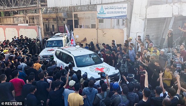 A Red Cross vehicle transports hostages, held in Gaza since the deadly October 7, 2023 attack