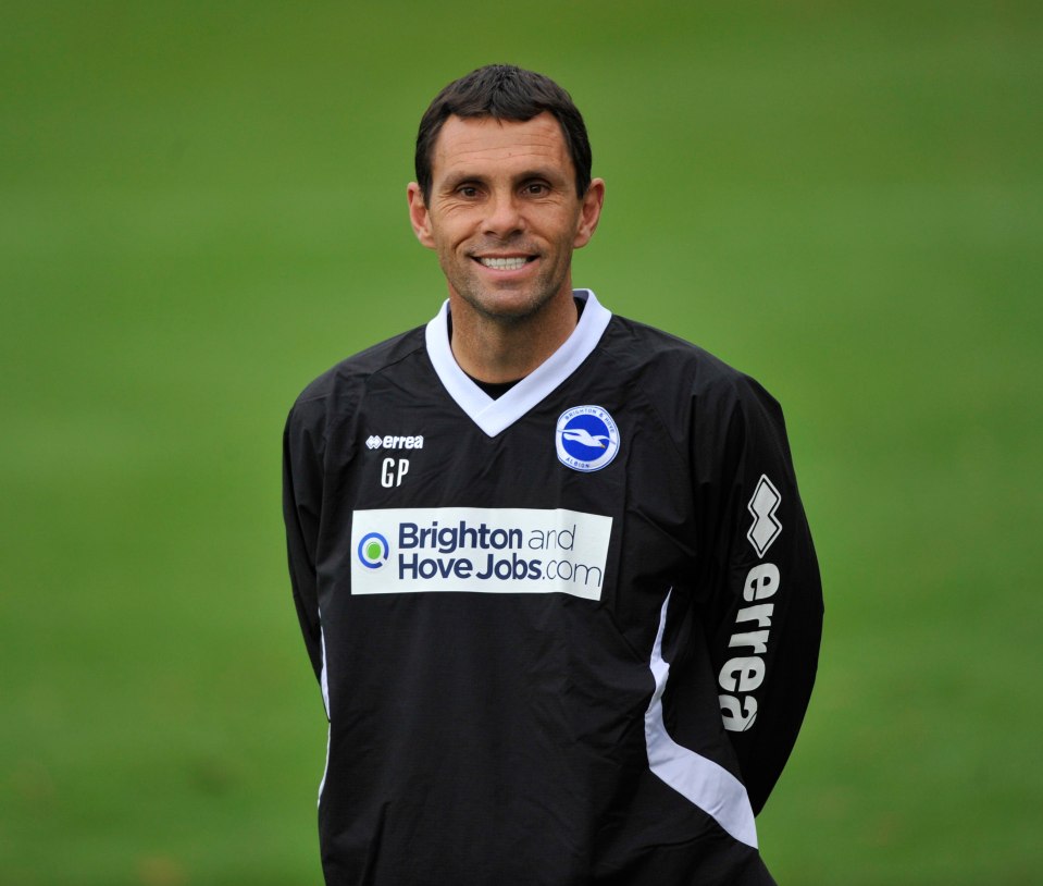 Gus Poyet, manager of Brighton & Hove, smiles during training.