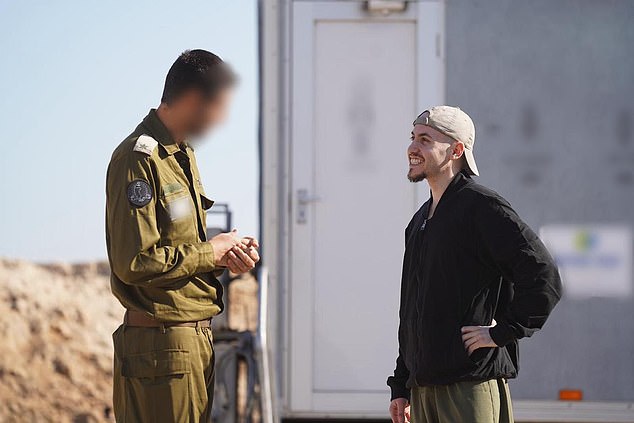 Released hostage Eitan Mor with IDF representatives
