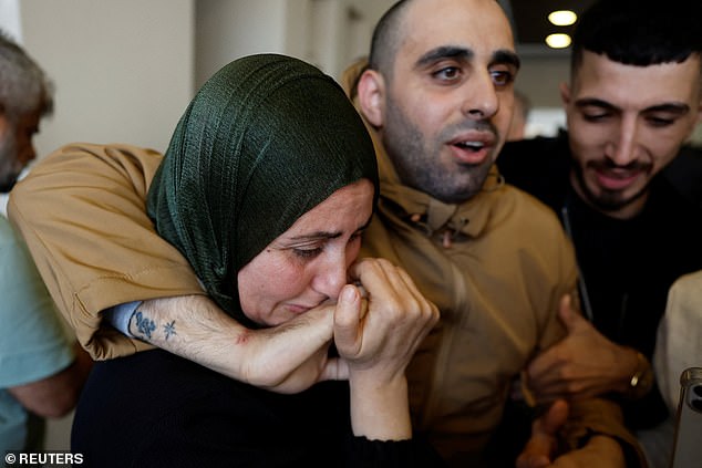 A freed Palestinian prisoner is greeted after being released from an Israeli jail as part of a hostages-prisoners swap and a ceasefire deal in Gaza between Hamas and Israel, in Ramallah , in the Israeli-occupied West Bank, October 13, 2025