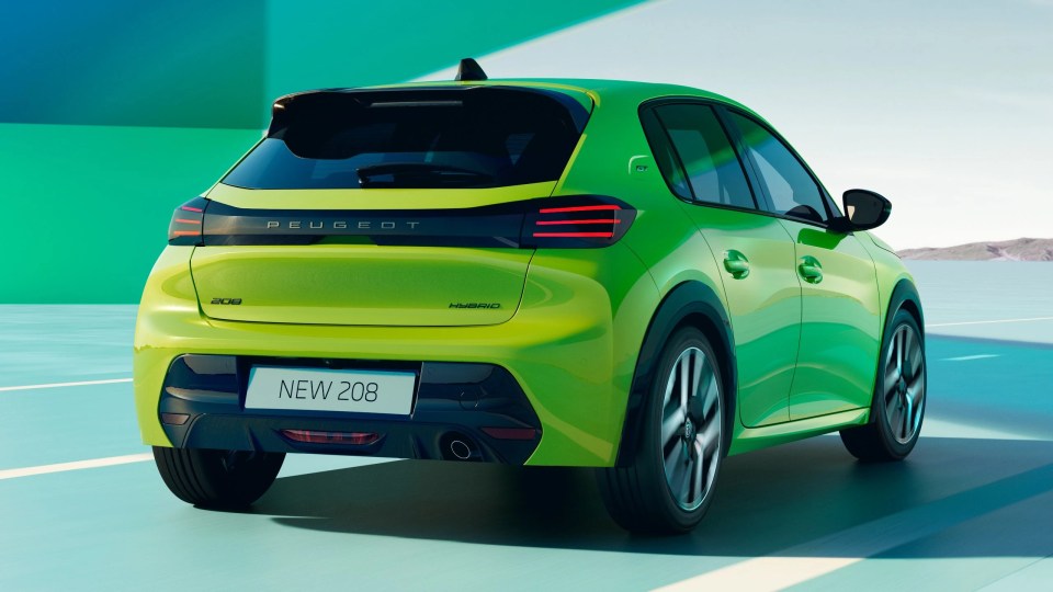 Rear view of a new green Peugeot 208 Hybrid car.