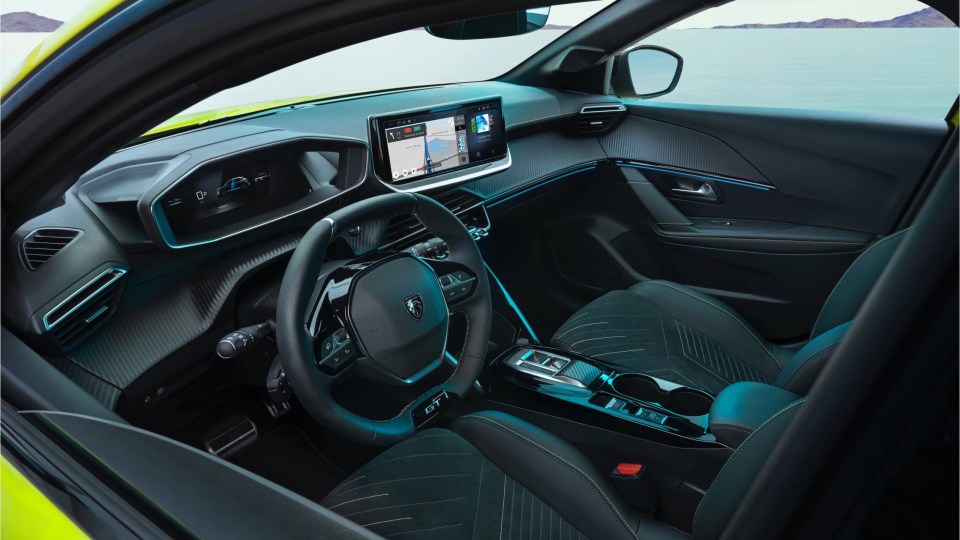Interior of the 2026 Peugeot 208, showing a square steering wheel, digital dashboard, and infotainment screen with navigation.