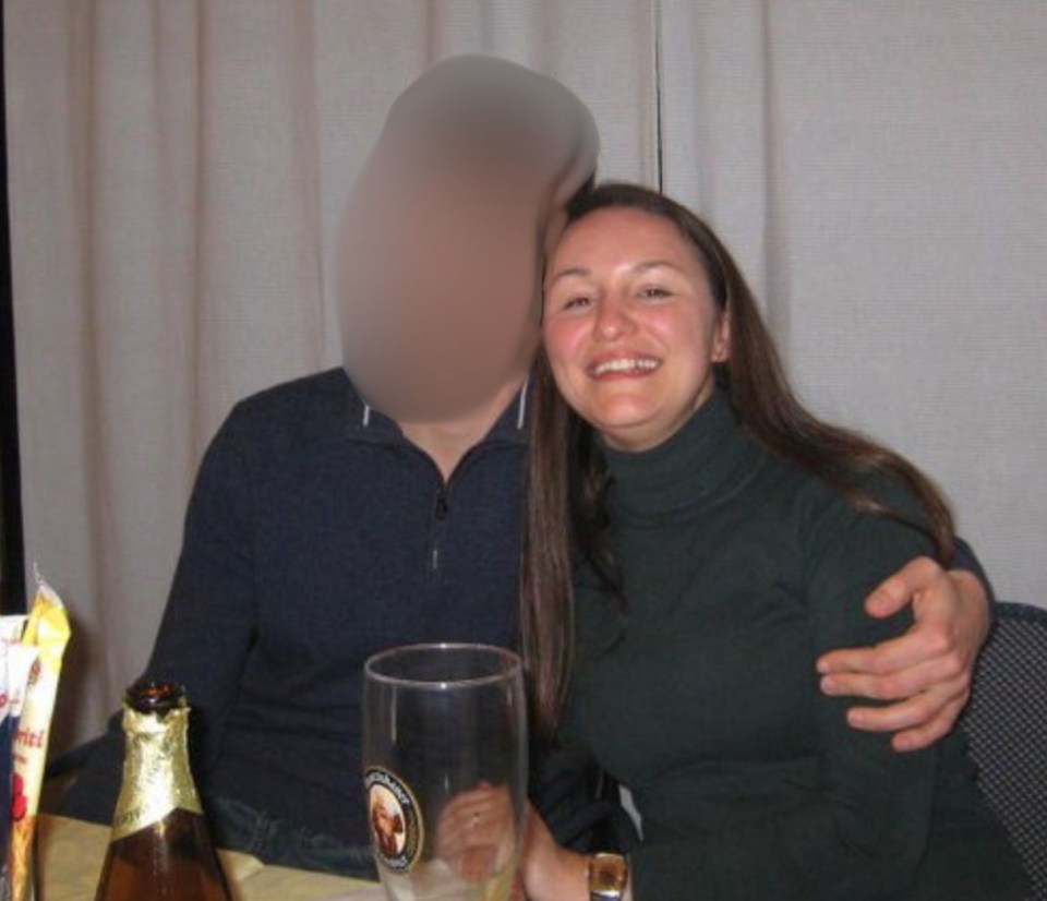 Carla Crivaro embracing Federico, whose face is blurred out, at a table with snacks and drinks.