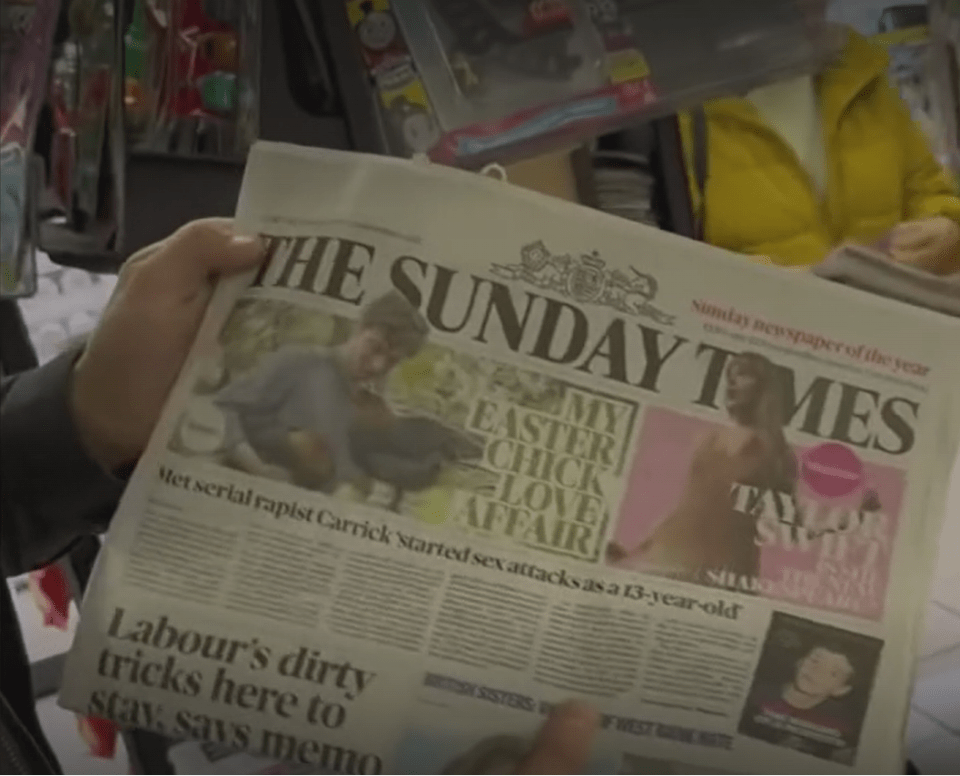 Hands holding a copy of "The Sunday Times" newspaper with headlines about a serial rapist and "Labour's dirty tricks".