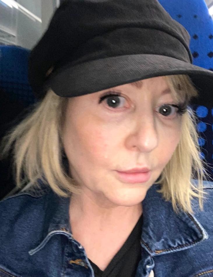 Sam Wall, the woman convicted of stalking, wearing a hat and denim jacket.