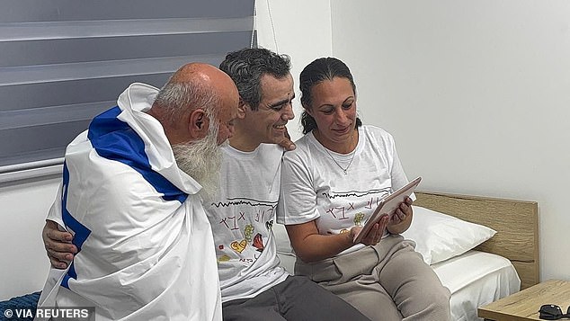 Omri Miran speaks to his two young daughters after over two years in Hamas captivity at the Re'im base