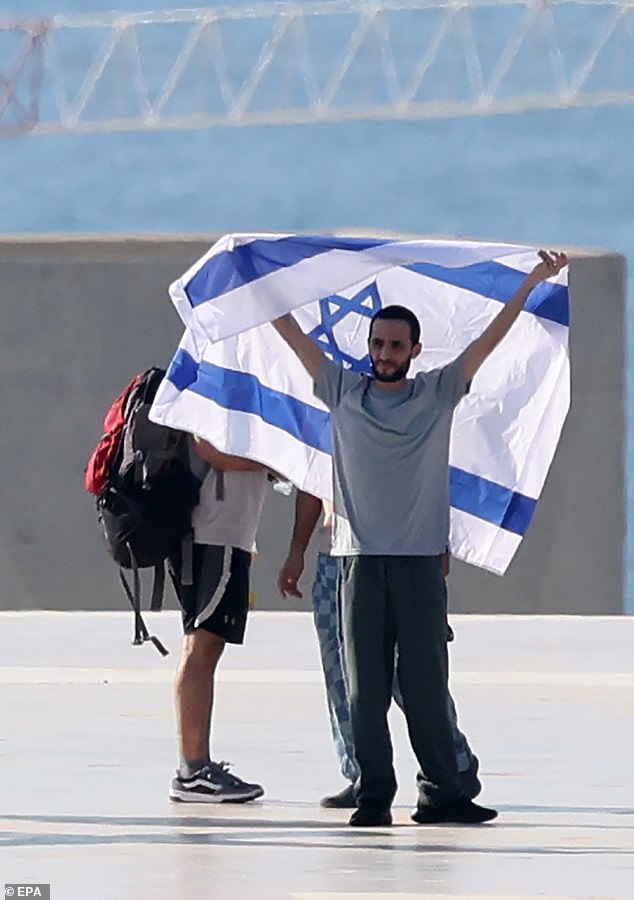 After his release today, he was seen looking frail under an Israeli flag