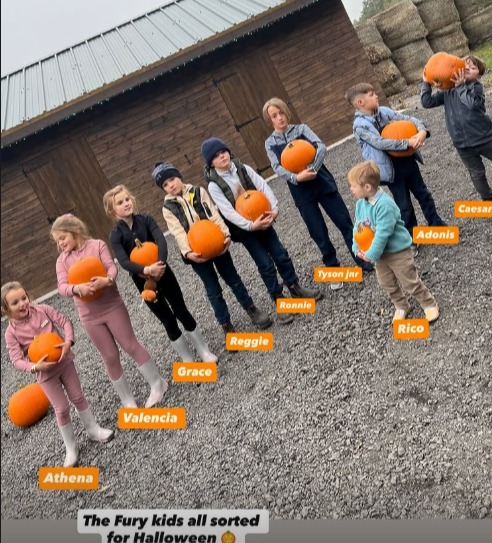 Tyson Fury's seven kids holding pumpkins for Halloween.
