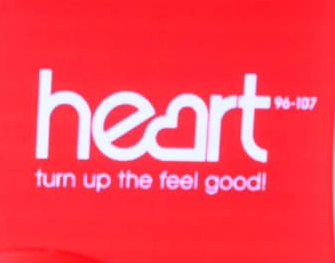 Heart radio logo on a red background.