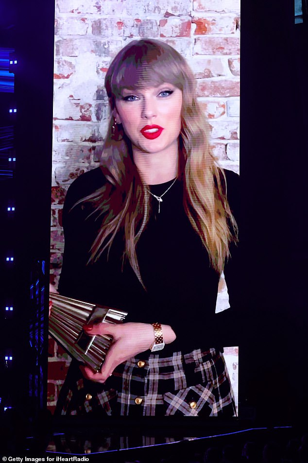 Taylor Swift fans were convinced the singer just shared a clue with her snake necklace she wore for her virtual iHeartRadio Awards acceptance speech in March