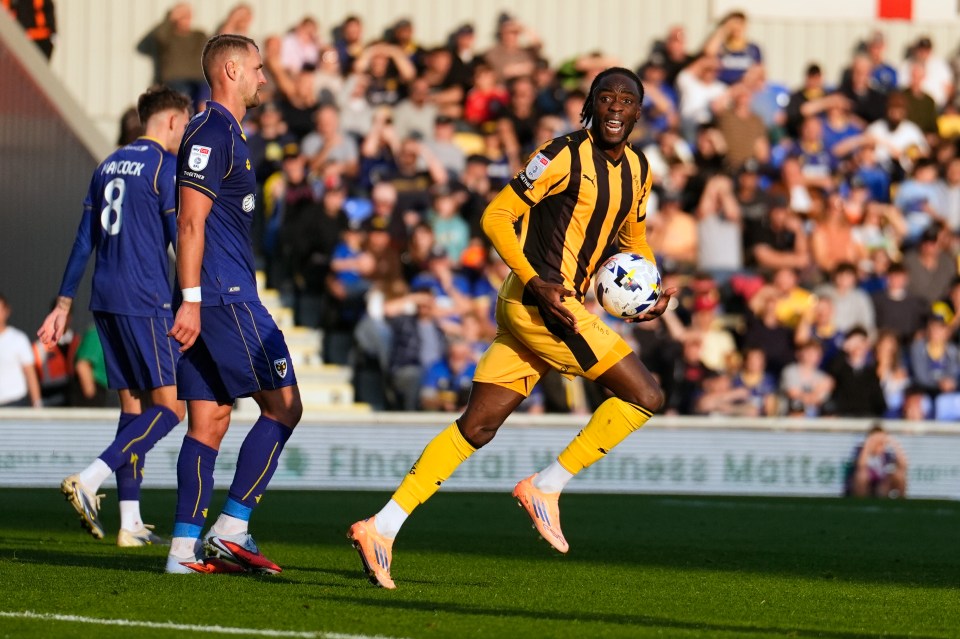 Port Vale's Devante Cole holding the ball after scoring against Wimbledon.