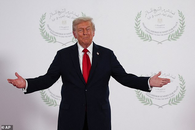 Trump waits to greet leaders during the summit in Sharm El Sheikh, Egypt