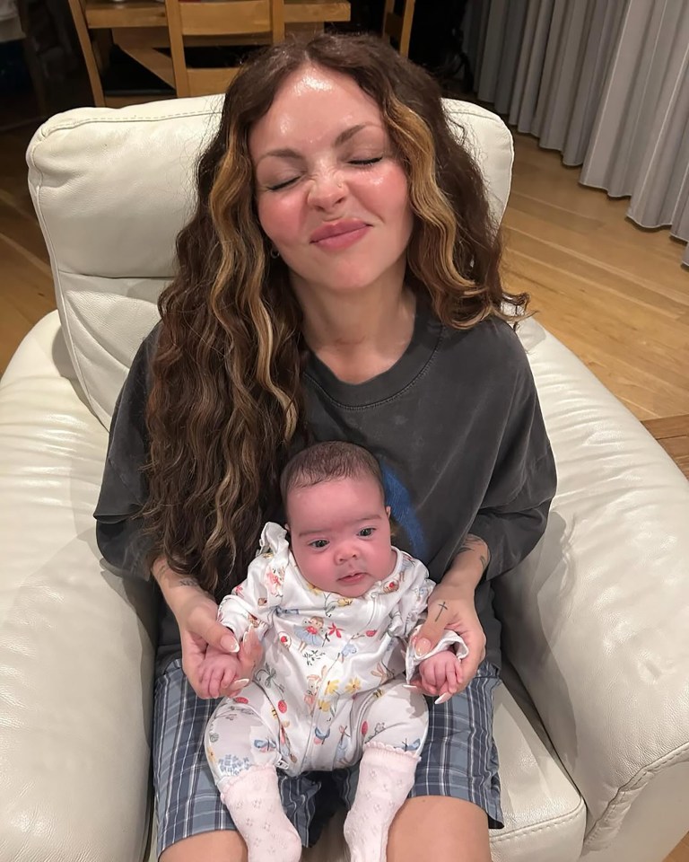 Woman holding a baby.