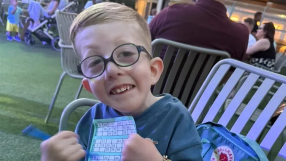 Freddie Michael Webster holding a bingo card.