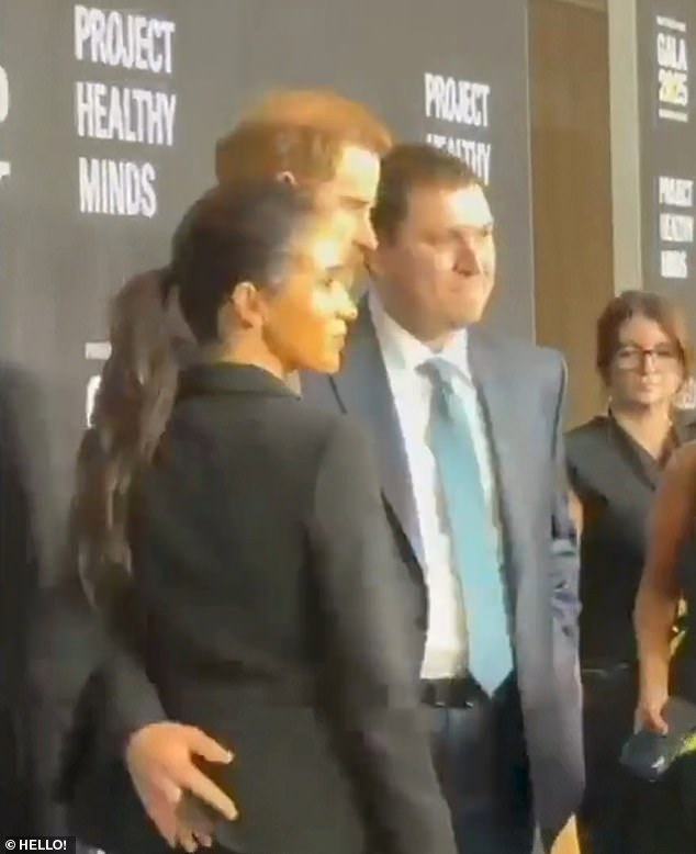 This is the moment Meghan appears to ask Prince Harry to move his hand off her bottom as more footage emerges from their awkward New York red carpet appearance