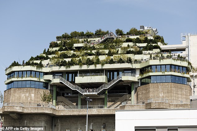 A pyramid-like shape was added to the existing high-rise bunker, creating a new 'mountain path' and rooftop garden with views of Hamburg