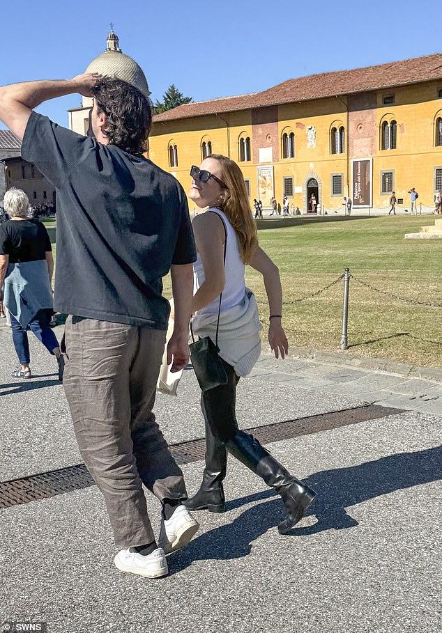 Emma was wearing a Frame X Ritz jumper with leggings and a crossbody bag as she walked along with the man, just days after she denied she was engaged to her boyfriend Kieran Brown