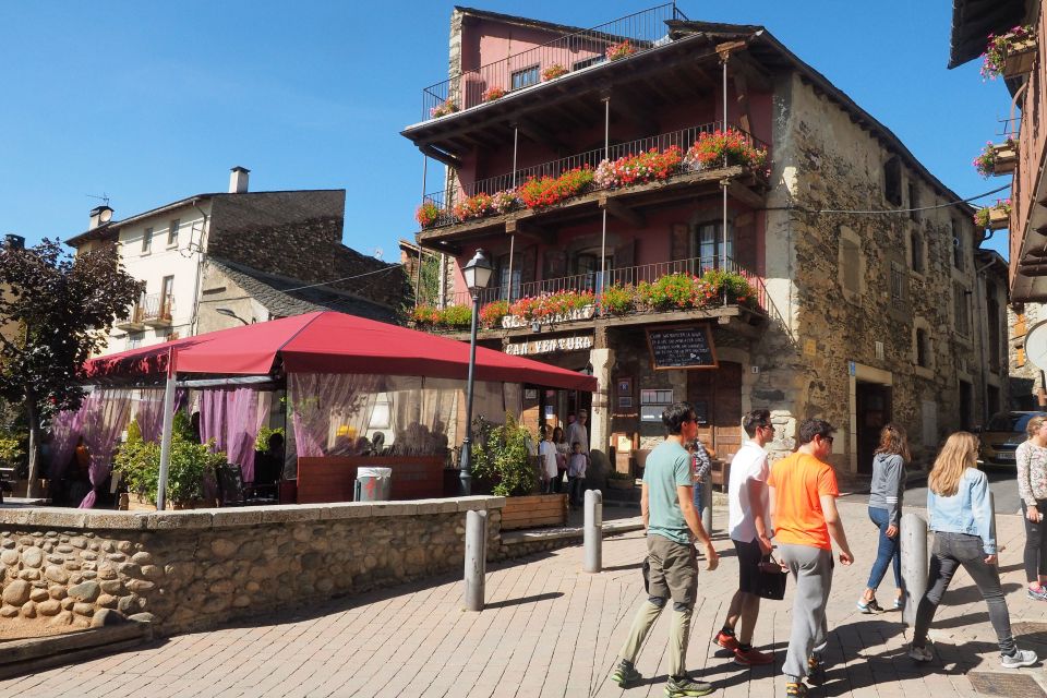 People walking on a street in Llívia, a Spanish enclave.