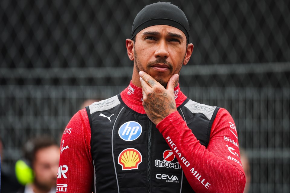 Lewis Hamilton in his Scuderia Ferrari SF-25 racing suit and black head covering, with a pensive expression, during the 2025 Formula 1 Heineken Dutch Grand Prix.