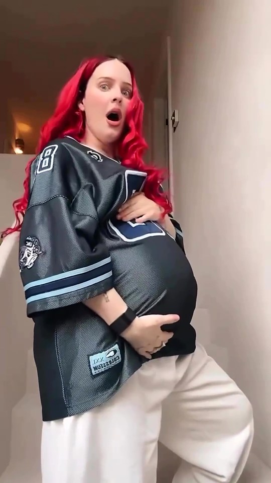 Anne-Marie showing her pregnancy bump.