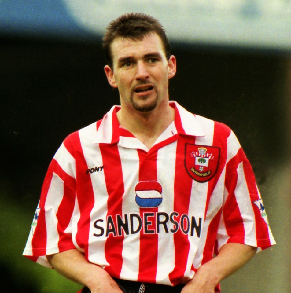 Tommy Widdrington of Southampton pulling up his shorts during a match against Chelsea.