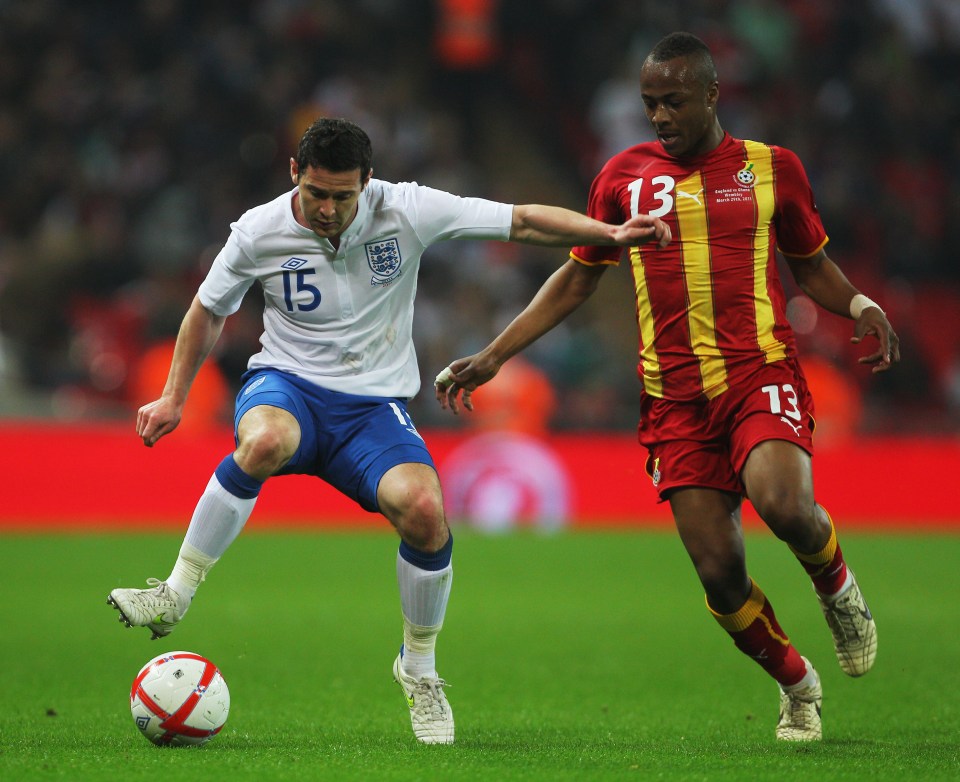 Matt Jarvis of England controls the ball under pressure from Morgan Ayew-Dede of Ghana.
