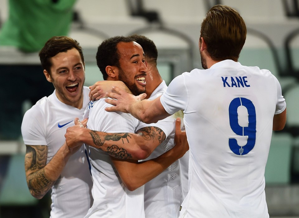 Andros Townsend of England celebrates scoring with teammates Ryan Mason, Harry Kane and Kyle Walker.