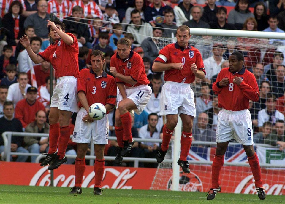 England players Frank Lampard, Gareth Southgate, Steve Guppy, Alan Shearer, and Paul Ince defend a free-kick.